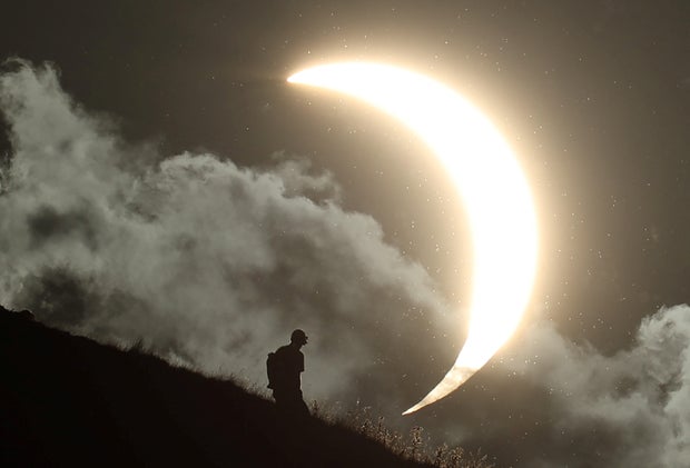 Partial solar eclipse at Glastonbury Tor in UK 