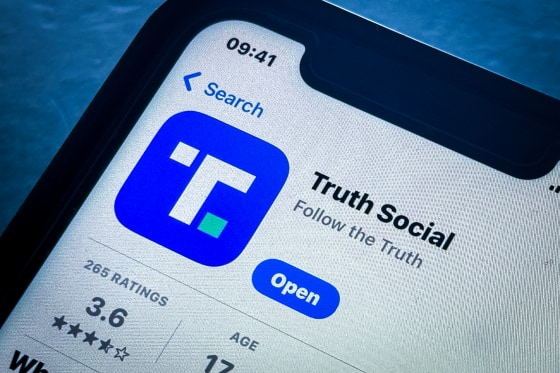 Donald Trump's Truth Social app logo on a smartphone.