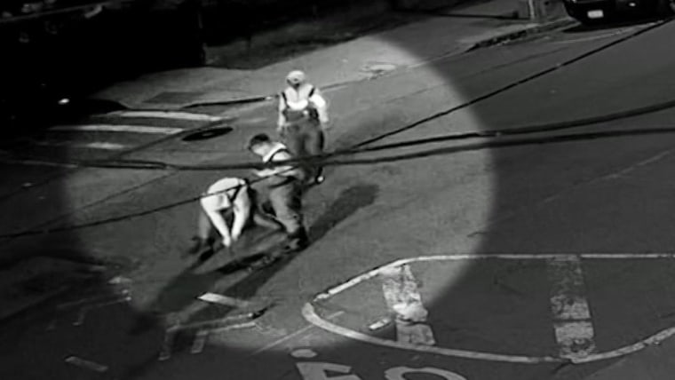 New video shows a group wearing hip waiters and carrying flash lights as they pry open a manhole cover on May 5th just before 2 a.m. in Astoria.