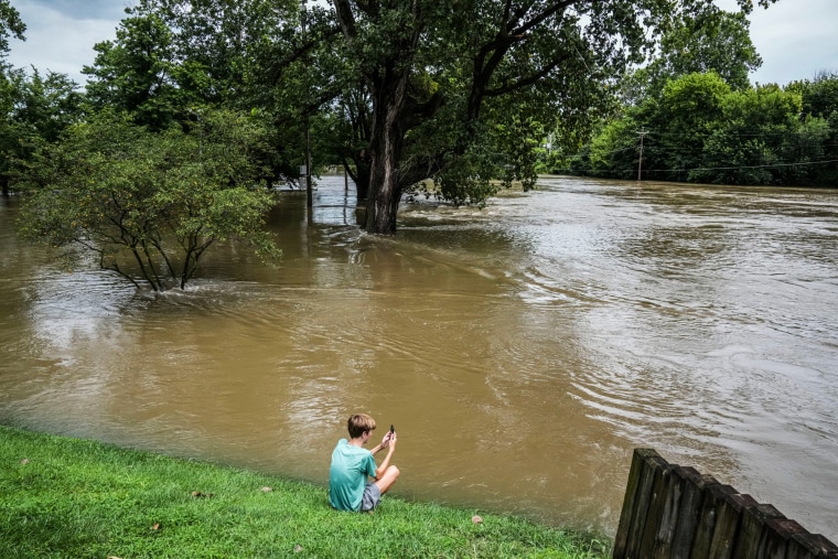 Chace Dexter films the White River flood waters