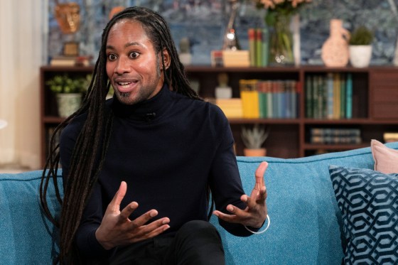 Jason Arday speaks while sitting on a couch on a television set