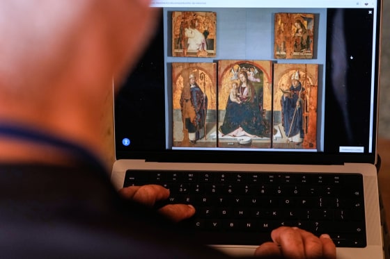 A journalist browses the Messina museum website showing a picture of the Early Renaissance painter Antonello da Messina's artwork