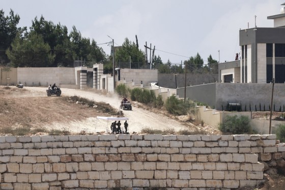 Israeli settlers drive off-road vehicles near besieged Palestinian houses in Qusra in the occupied West Bank on Aug. 17, 2026.