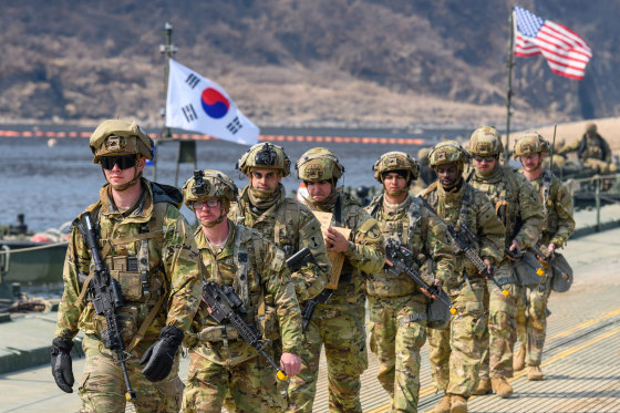 U.S. Army soldiers cross a pontoon bridge on the Imjin River