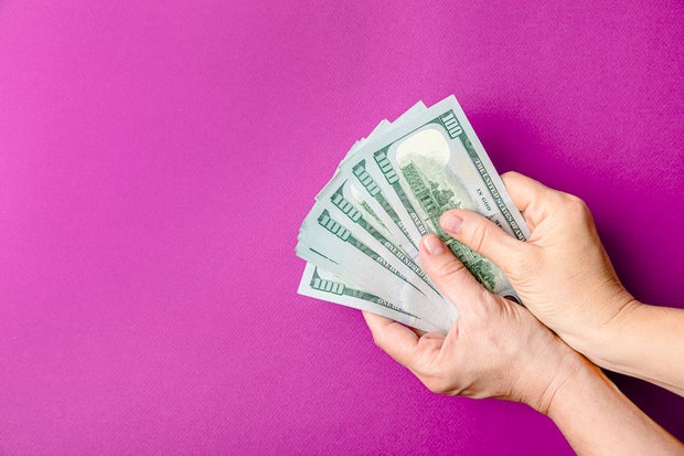 Hand holding dollars 