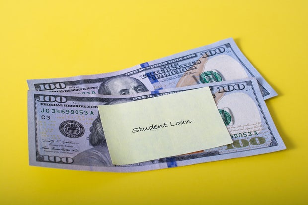 'Student Loan' note posted to two one hundred dollar bills 